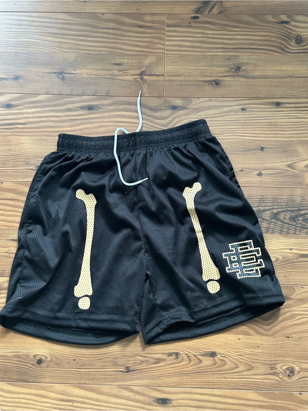 Eric Emanuel Black Mesh Shorts with Gold Bone Graphics